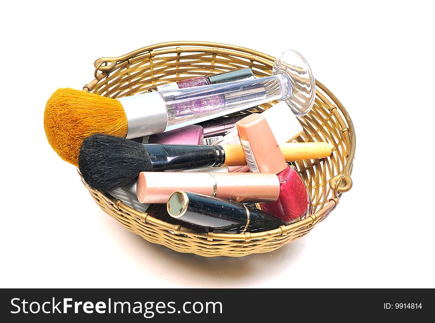 Cosmetic and brushes in basket.