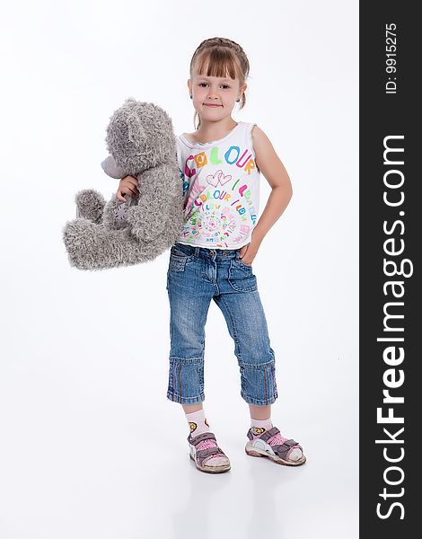 Little girl with a toy on white background. Little girl with a toy on white background