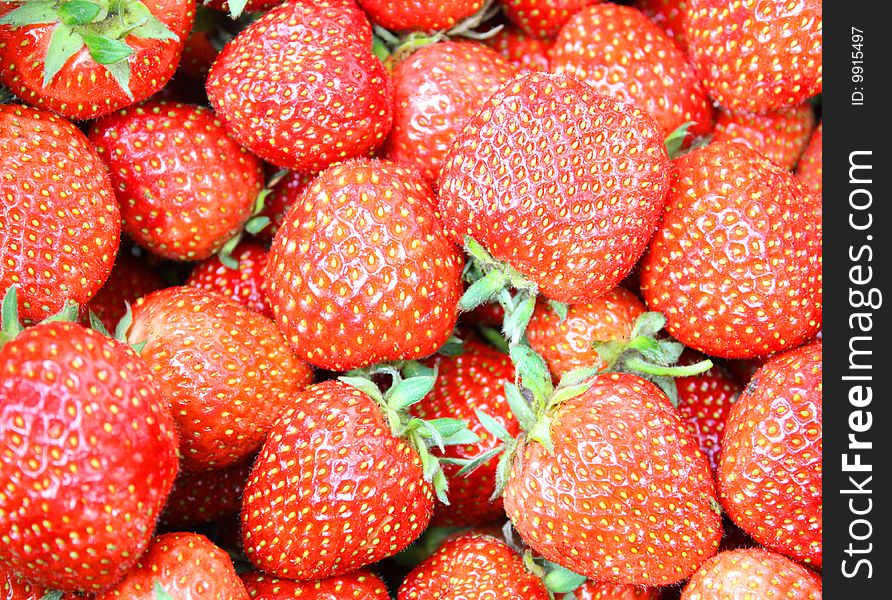 Fresh strawberries background. Color image
