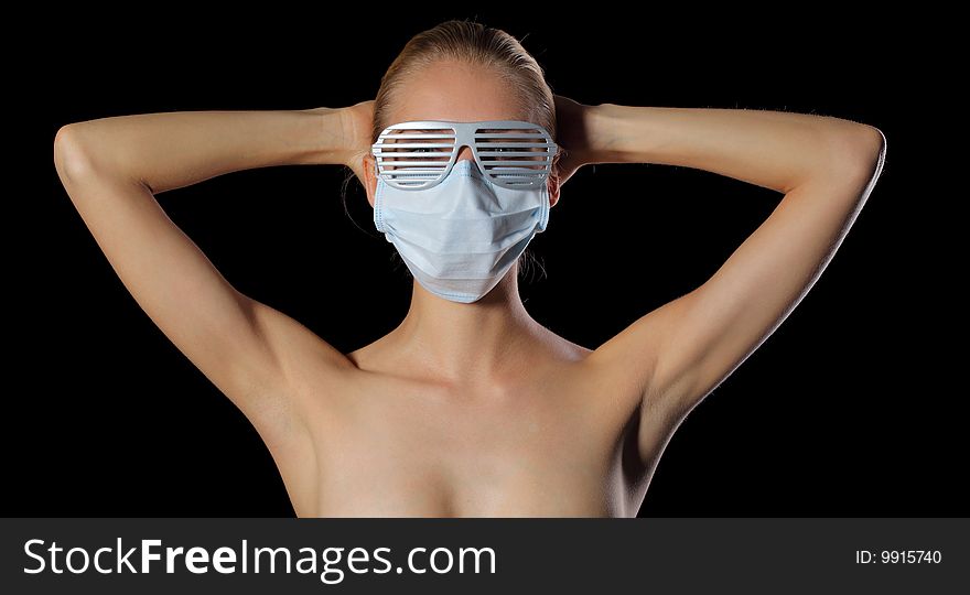 Young woman in glasses and protective mask. Young woman in glasses and protective mask
