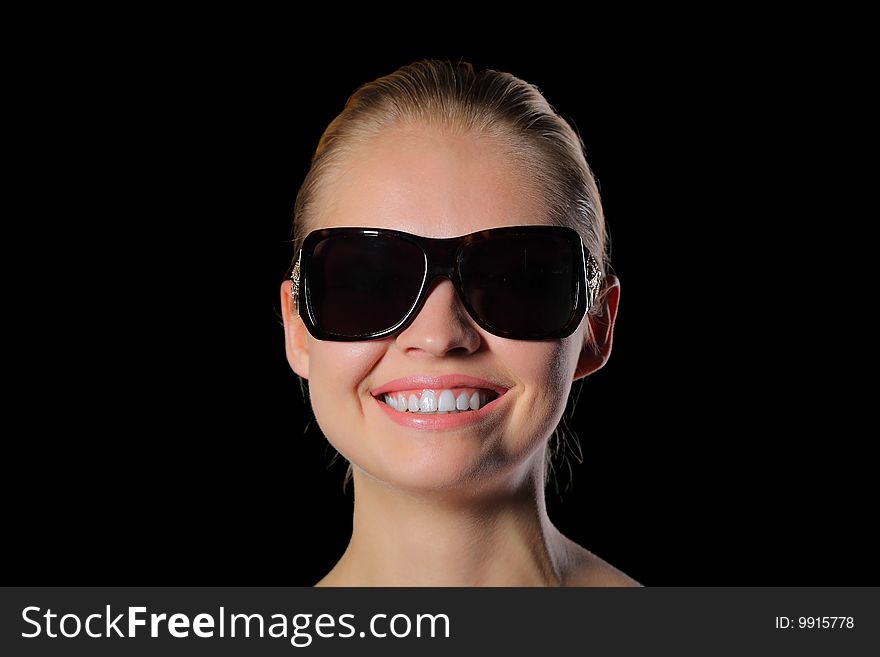 Young woman in sunglasses smiling
