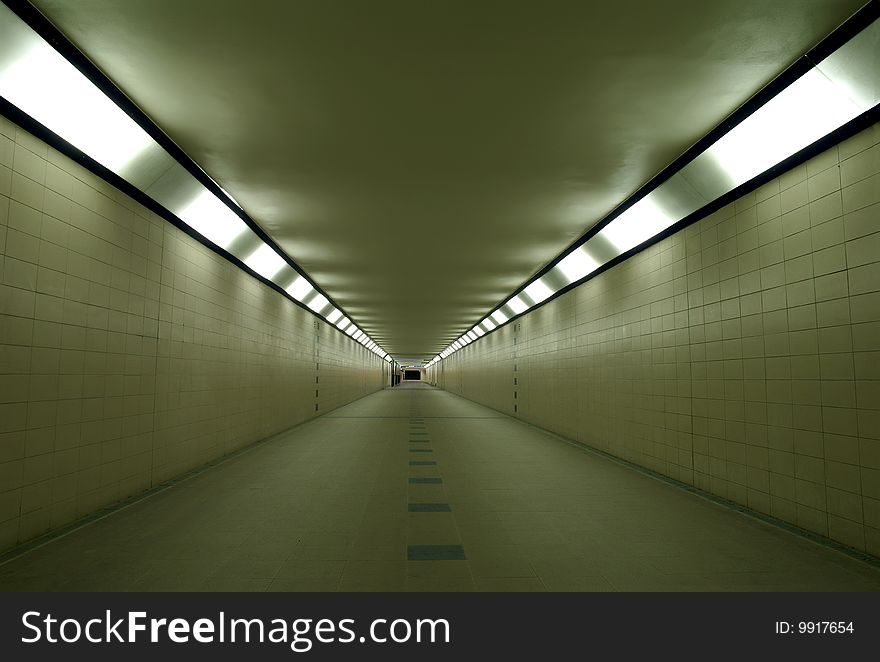 Evening empty subway below train station leading to the platforms. Evening empty subway below train station leading to the platforms.