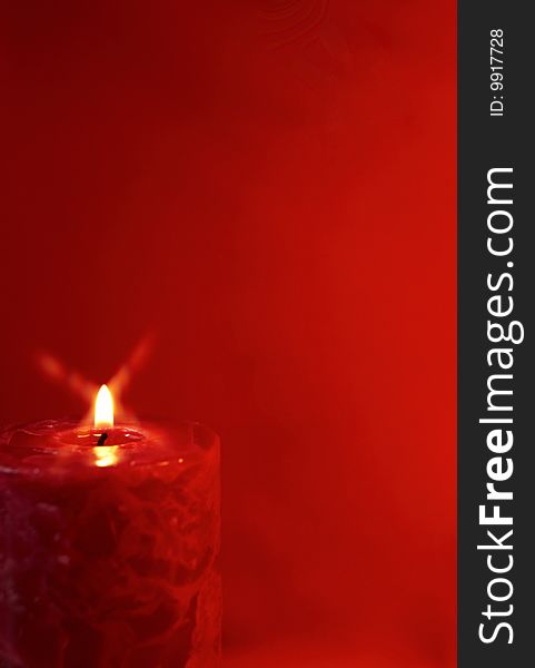 Red candles on a red background