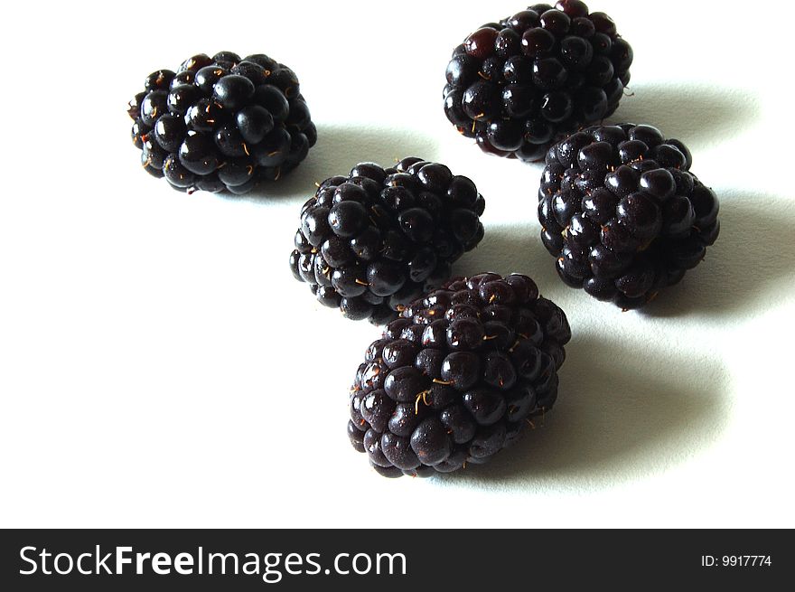 Blackberries on a white background.