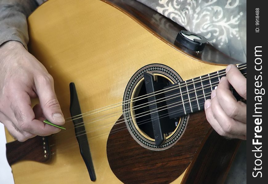 Guitarist. Hands of the guitarist playing on guitar