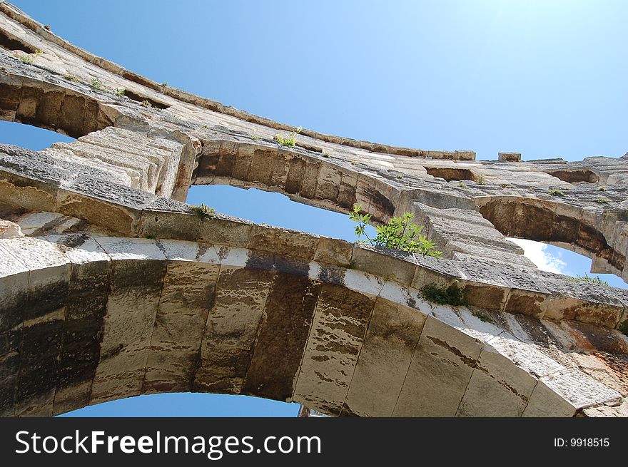 Arches of a Roman colosseum, in Pula, Croatia. Arches of a Roman colosseum, in Pula, Croatia.
