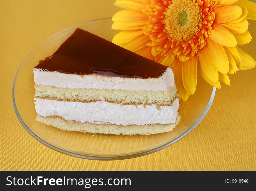 Cake with caramel on a yellow background
