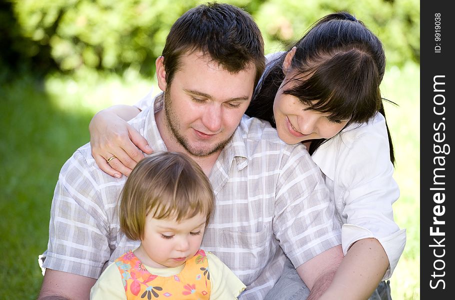 Mother, father and daughter together in park. Mother, father and daughter together in park