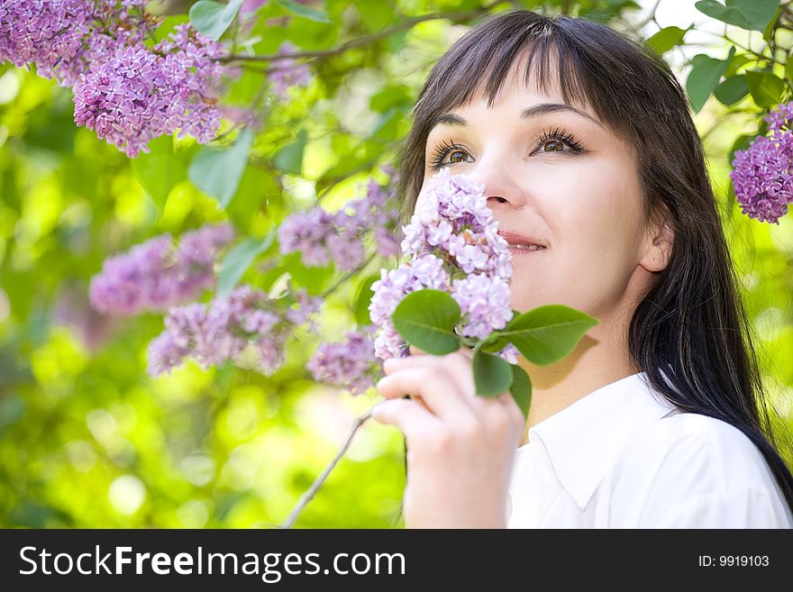 Attractive brunette woman relaxing in park. Attractive brunette woman relaxing in park