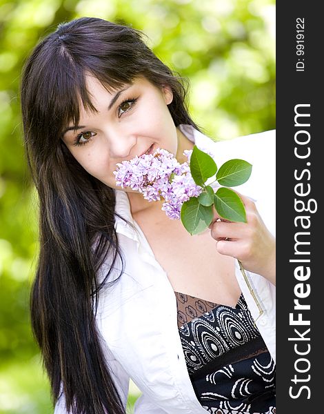 Attractive brunette woman relaxing in park. Attractive brunette woman relaxing in park