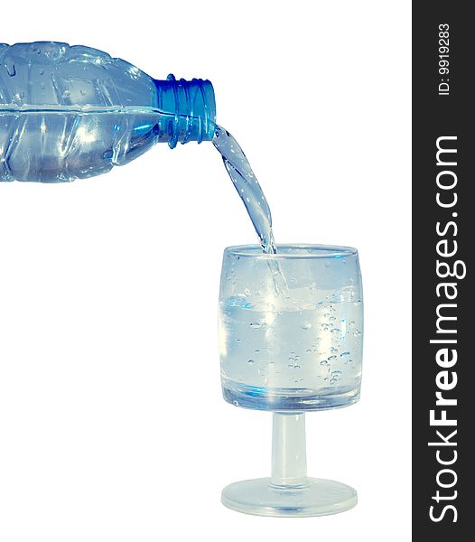 A bottle and a glass of water isolated