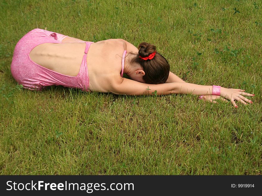 Girl lying on grass in a park