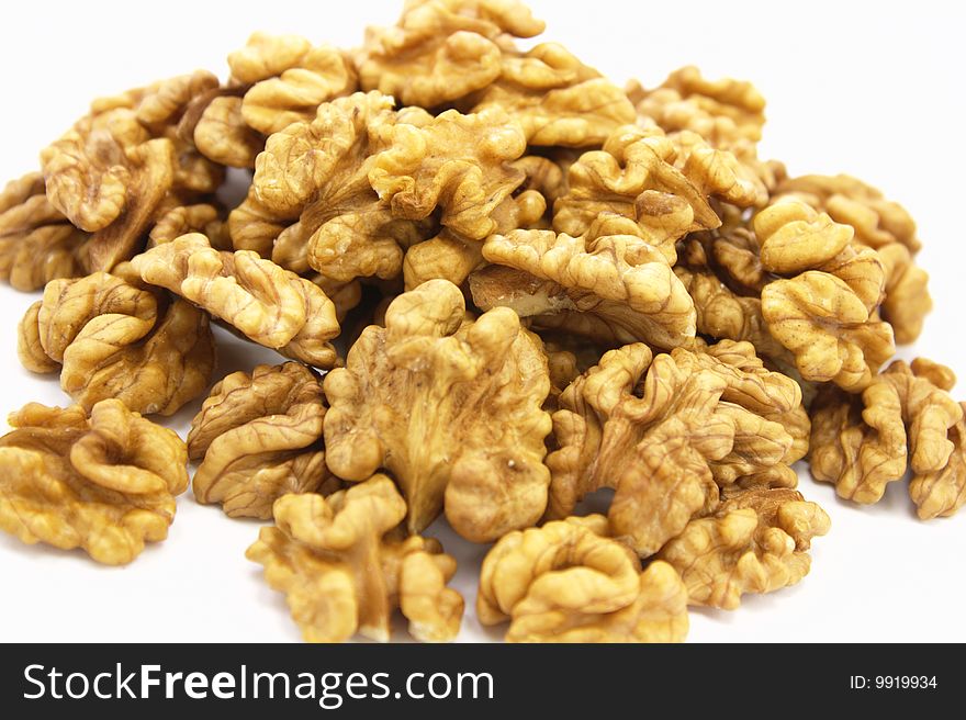 Walnuts pile on white background