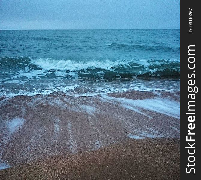 Waves Coming In To Sandy Beach