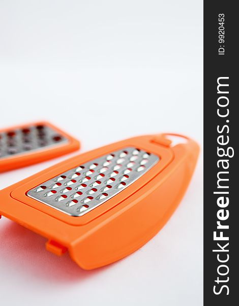 Small new kitchen grater. Limited focus. Small new kitchen grater. Limited focus.