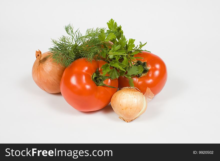 Tomatoes and onions on white background. Tomatoes and onions on white background.