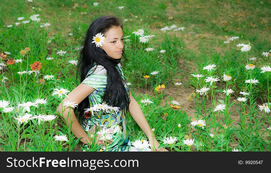 Pretty Girl In A Flower Field