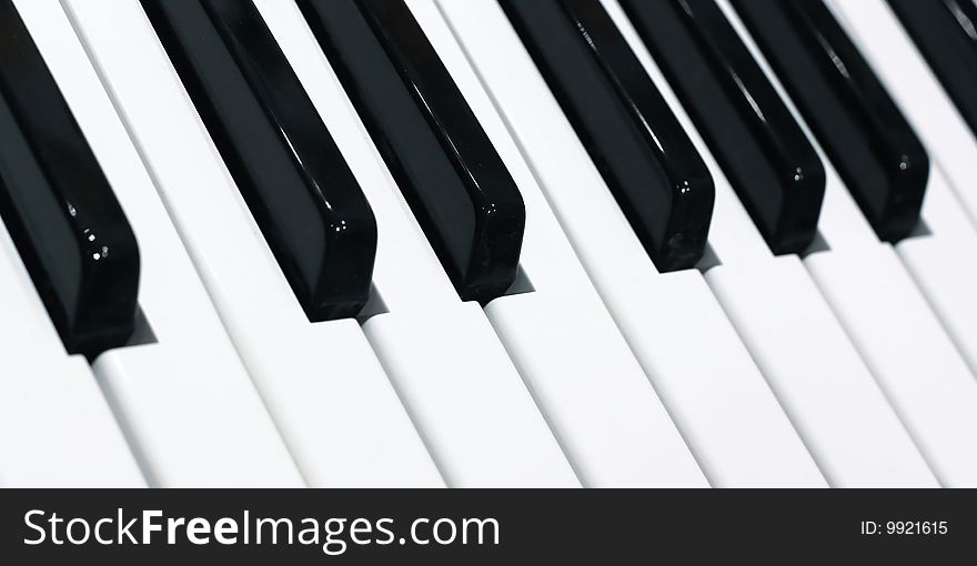 Piano keyboard with black and white buttons