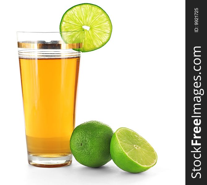 Limes and juice in glass