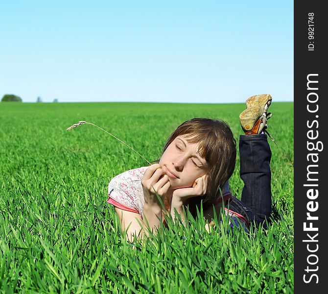 Young woman in green grass