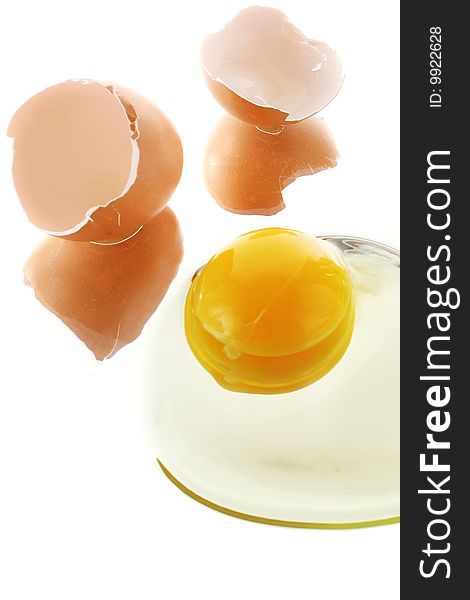 Broken egg with shell over white