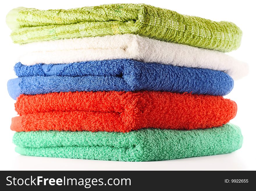Colored bath towels isolated on white