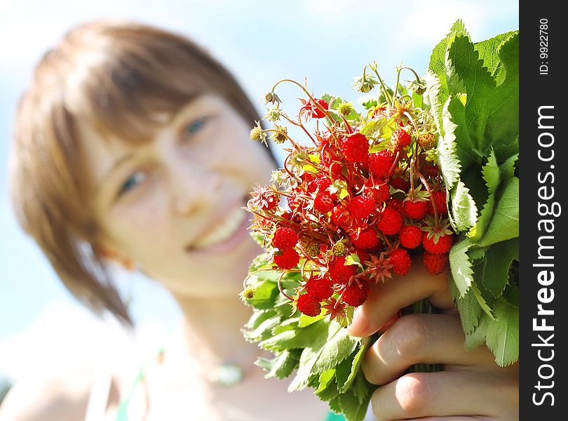 Young smiling woman with srawberry bouquet. Young smiling woman with srawberry bouquet