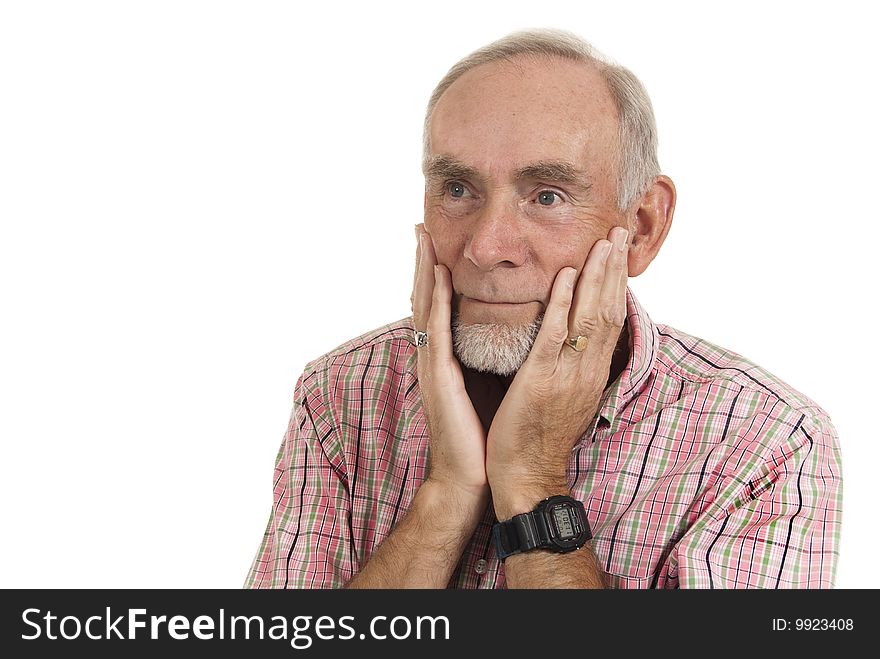 Senior man with contented expression holding his face in his hands as he has happy memories, perhaps. Senior man with contented expression holding his face in his hands as he has happy memories, perhaps.