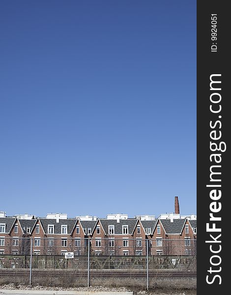 A row of suburban houses with copy space. A row of suburban houses with copy space.