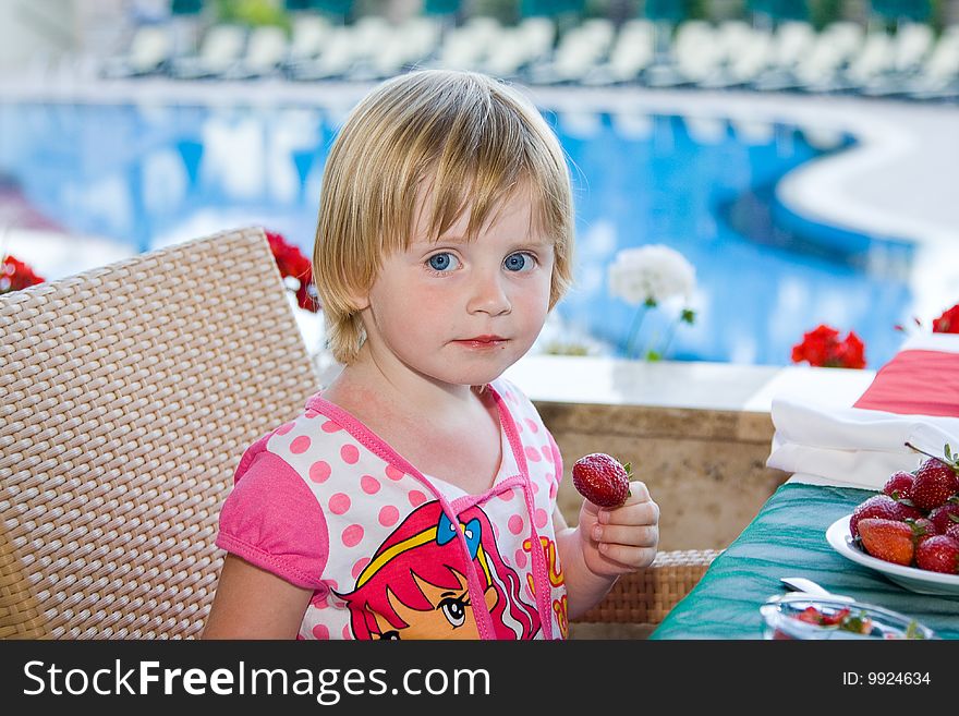 Young girl eating in restaurant. Young girl eating in restaurant