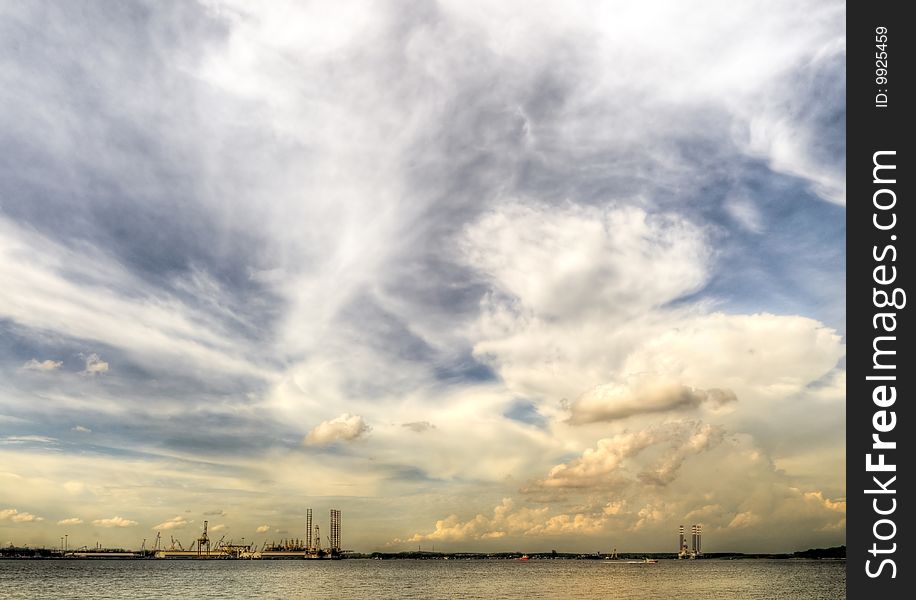 Industrial activities on a tropical coastline in the late afternoon. Industrial activities on a tropical coastline in the late afternoon