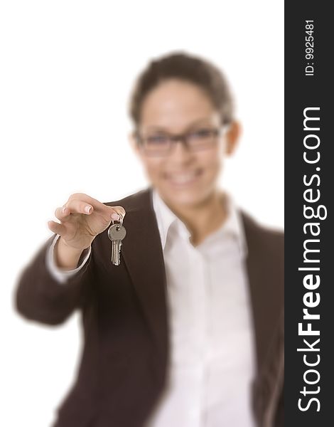 Businesswoman holding keys over white background, selective focus, focus on the keys