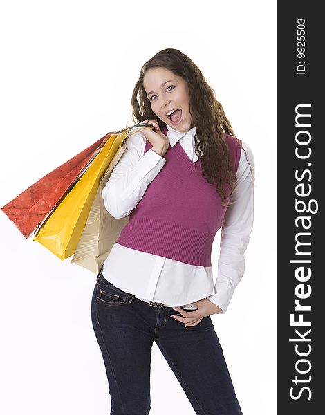 Young woman holding colored shopping bags. Young woman holding colored shopping bags