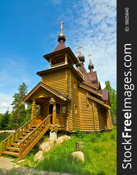 Beautiful wooden church on the background of blue sky. Beautiful wooden church on the background of blue sky