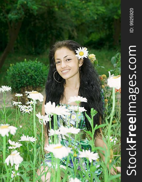 A Girl And A Field Of Flowers