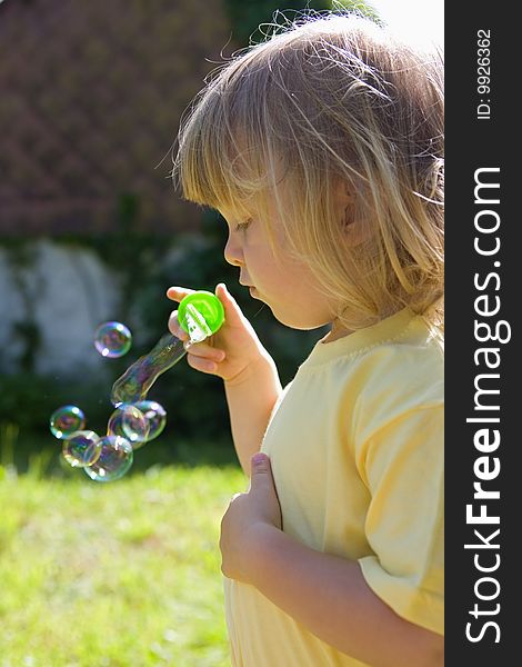 Boy blowing bubbles