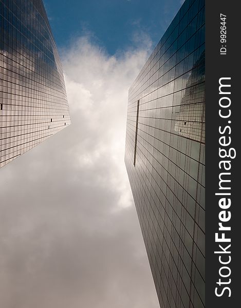 Stormy sky reflected in a modern glass office building. Stormy sky reflected in a modern glass office building