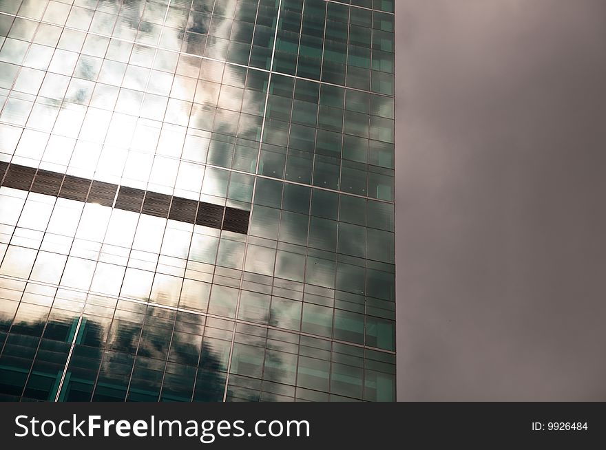 Stormy sky reflected in a modern glass office building. Stormy sky reflected in a modern glass office building