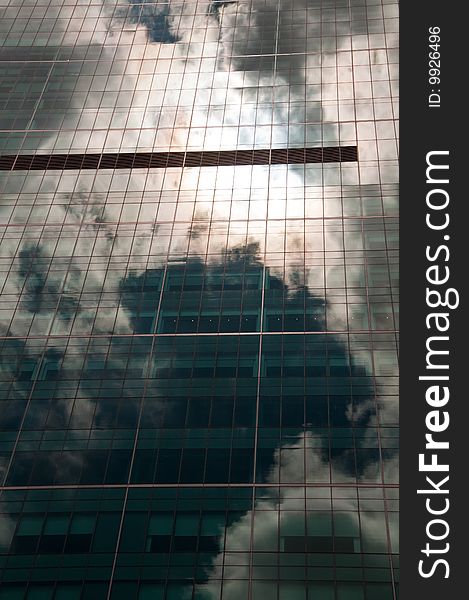 Stormy sky reflected in a modern glass office building. Stormy sky reflected in a modern glass office building