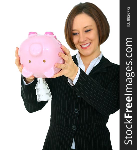 Excited female caucasian shaking her piggy bank with a lot of money come out. Excited female caucasian shaking her piggy bank with a lot of money come out