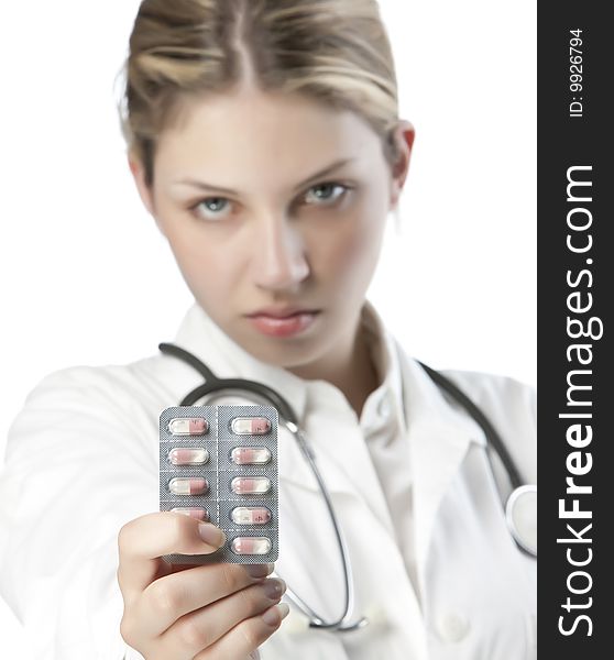 Female doctor handing medicine isolated on white