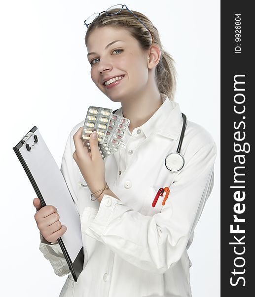 Female doctor handing medicine isolated on white