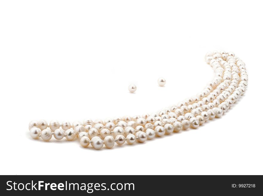 Pearl necklace look like a smile on white background. Pearl necklace look like a smile on white background