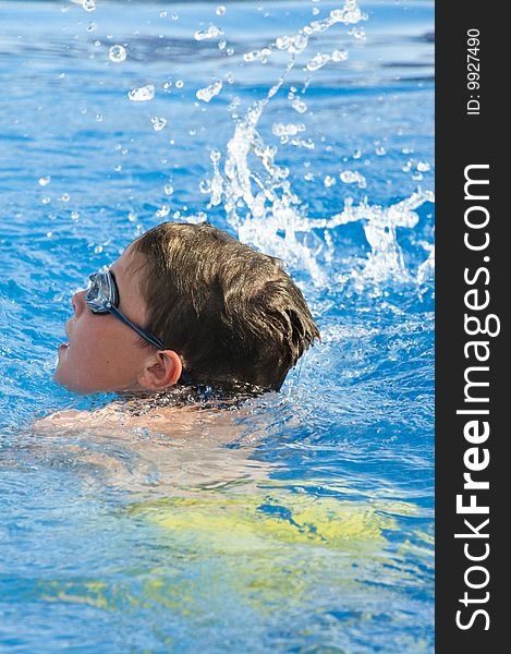 Picture of a boy on a swimming pool