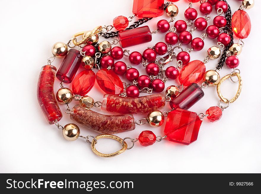 Red gem necklace closeup on white