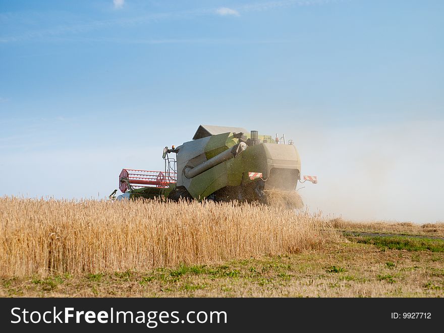 Combine harvester harvesting crop in the field.