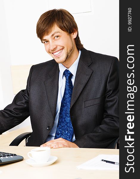 Successful businessman working at the computer in his office. Successful businessman working at the computer in his office