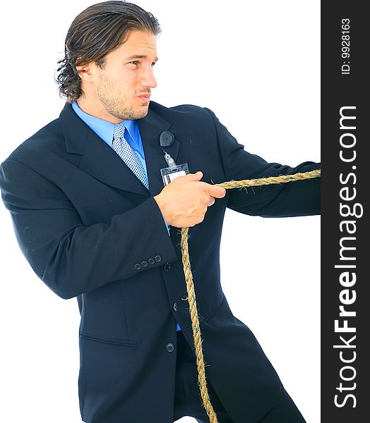 Young male businessman struggle to pull a rope. concept for business competition. Young male businessman struggle to pull a rope. concept for business competition