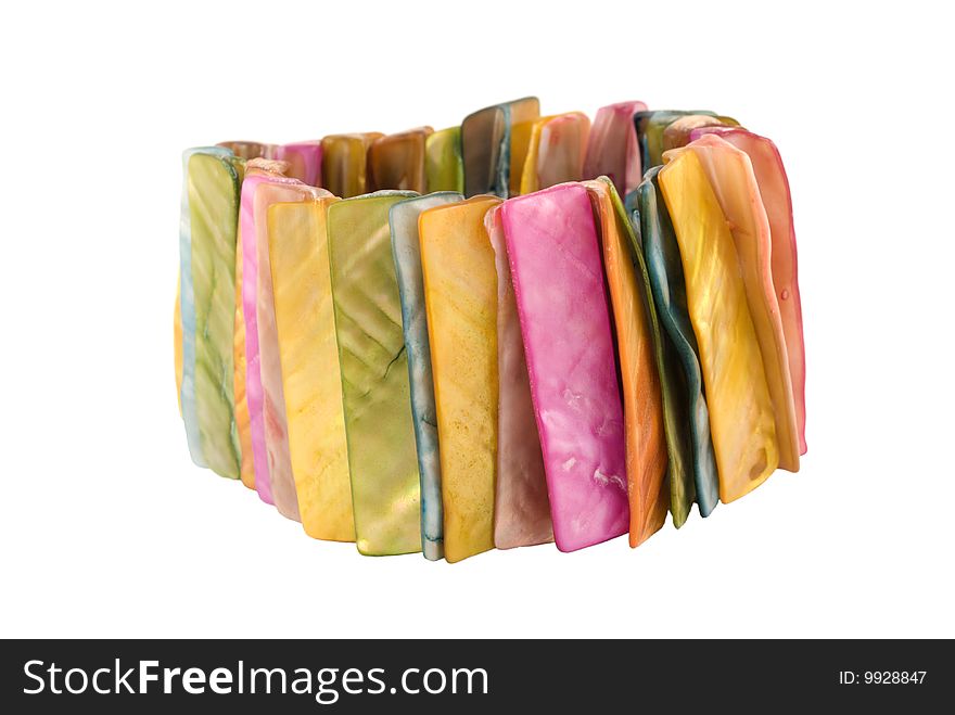 A beautiful bracelet made of colorful strips of sea shells. Isolated on white. Adobe RGB color profile. A beautiful bracelet made of colorful strips of sea shells. Isolated on white. Adobe RGB color profile.