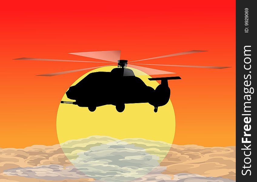 Armed helicopters  flying in the sunset.